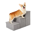 Corgi standing on grey Pet Awesome dog stairs smiling beside bed