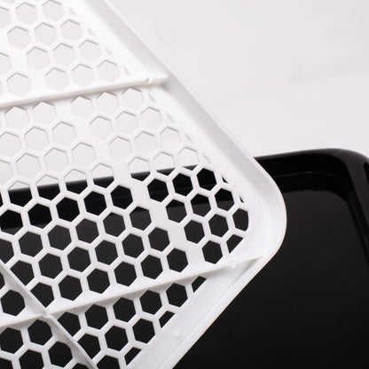 Honeycomb pattern close-up of Pet Awesome dog potty tray grid surface