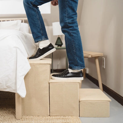 Person stepping on Pet Awesome beige dog stairs to show durability and stability